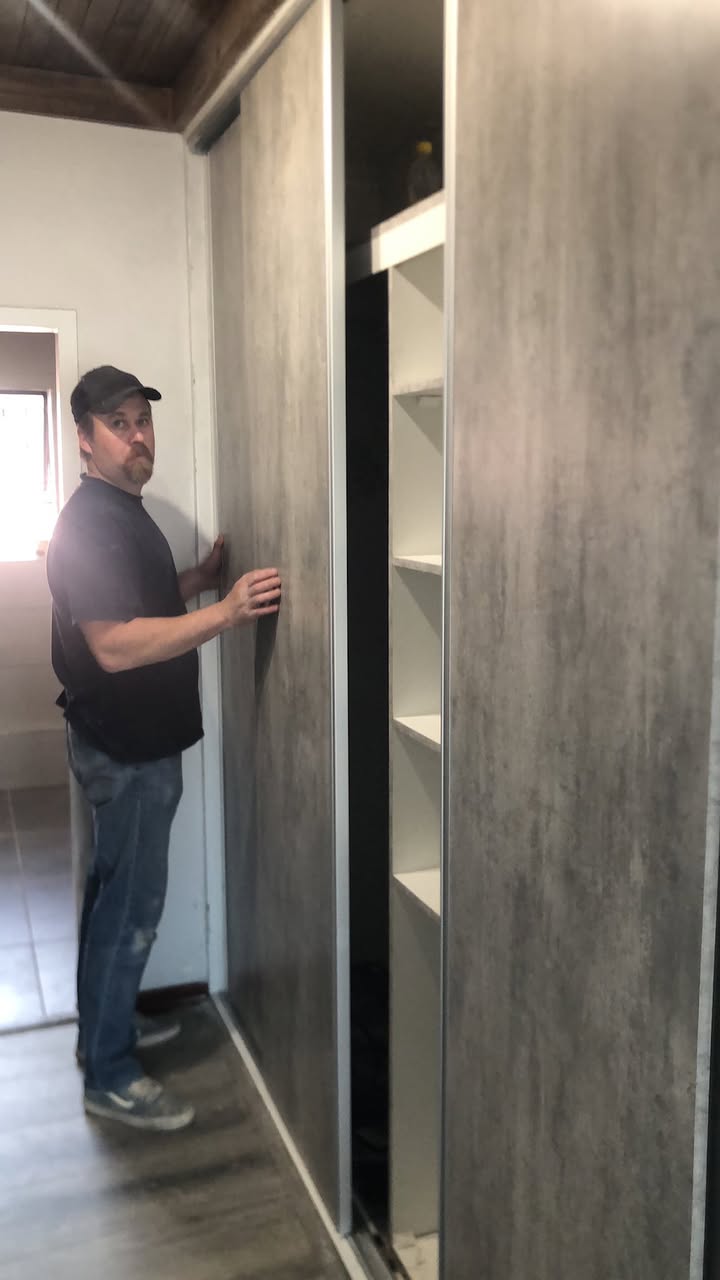 Chad installing a sliding wardrobe in a Johannesburg home