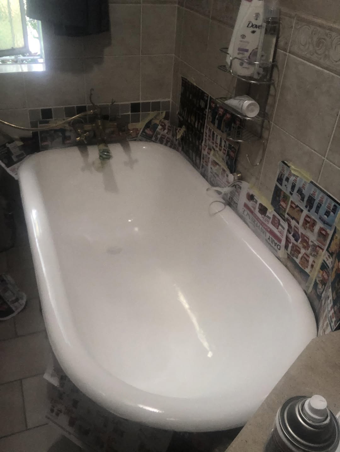 Bathroom mid-renovation with porcelain bathtub