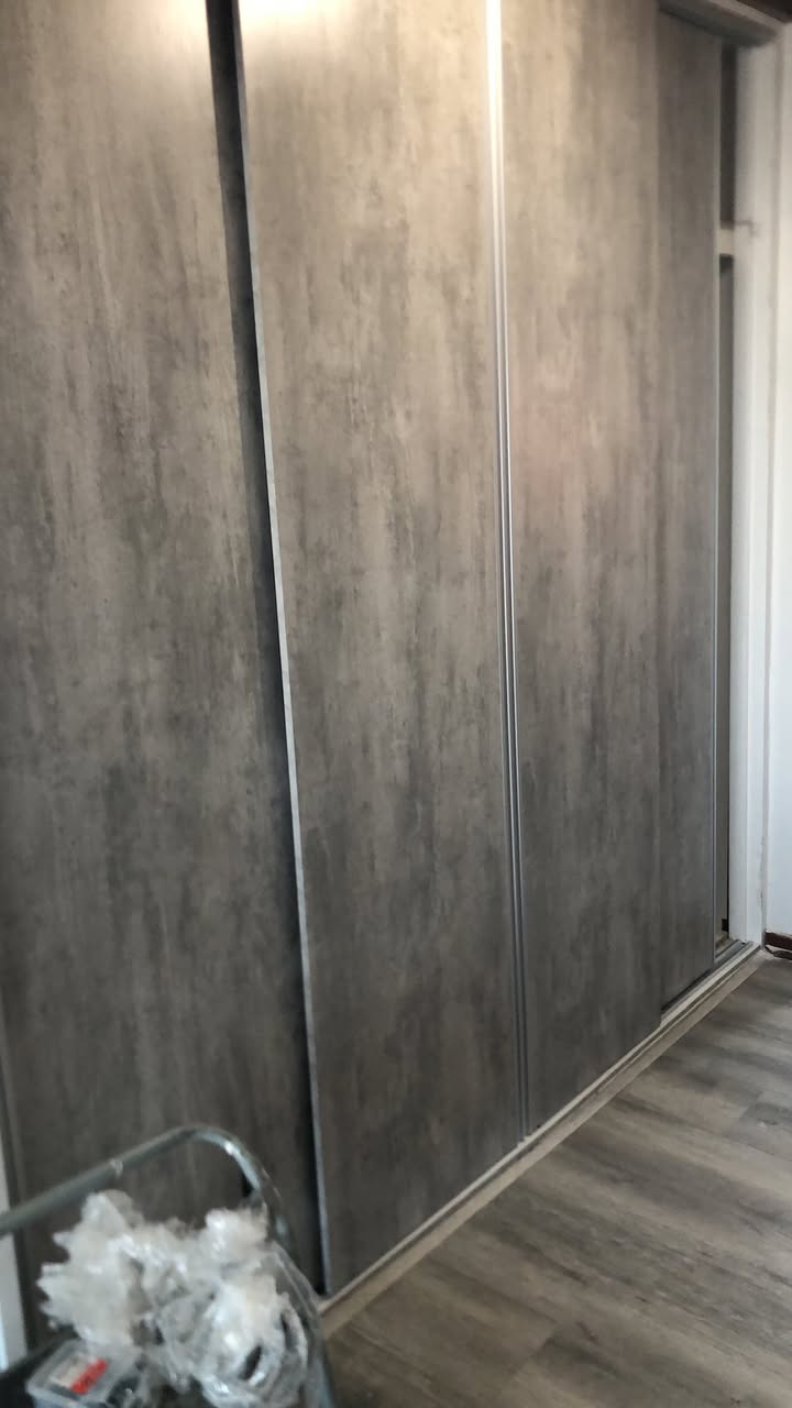 Concrete-textured sliding wardrobe doors